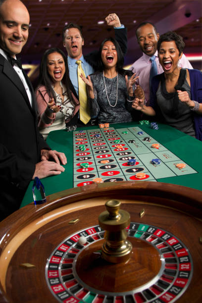 Live dealer in action Croupier spinning the roulette wheel during a live game session